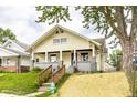 Charming craftsman home featuring a covered front porch, fresh paint, and landscaped front yard at 1206 Comer Ave, Indianapolis, IN 46203