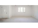 Empty living room with white walls and carpeting at 1217 Charleston Commons Dr # 25, Anderson, IN 46012