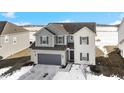 Two-story home with gray and white exterior, and a gray two-car garage at 17935 Paula, Westfield, IN 46074