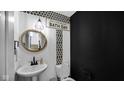 Modern powder room with black and white tile and a stylish vanity at 17935 Paula, Westfield, IN 46074