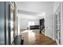 Bright entryway with hardwood floors, and a view into the living room at 17935 Paula, Westfield, IN 46074