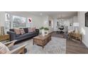 Open living space with gray sofa and wooden coffee table at 3338 E 50Th St, Indianapolis, IN 46205