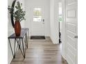 Bright entryway with wood-look floors and a stylish console table at 3872 Branch Cir, Franklin, IN 46131