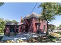 Back view of the house with a spacious patio and newly landscaped yard at 404 N State St, Greenfield, IN 46140