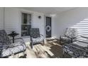 Inviting front porch with wooden floor and comfortable seating at 4462 S Morgantown Rd, Greenwood, IN 46143