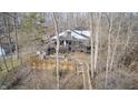 Beautiful aerial view of the home featuring wrap-around decks and wooded surroundings at 459 W Lakeview Dr, Nineveh, IN 46164