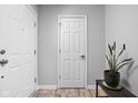Bright entryway with double doors, a white interior door, and a plant at 5772 Weeping Willow Pl, Whitestown, IN 46075