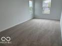 Neutral bedroom with carpet flooring featuring lots of natural light from the two large windows at 7541 Big Bend Blvd, Camby, IN 46113