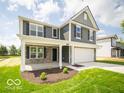 Attractive home with a covered porch, gray siding, white trim, and a well-maintained lawn at 7541 Big Bend Blvd, Camby, IN 46113