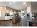 Modern kitchen with white cabinets, granite counters, and an island at 7675 E 500 N, Lebanon, IN 46052