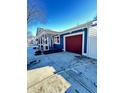 Burgundy garage door with a cracked driveway at 9519 Meadowlark Dr, Indianapolis, IN 46235