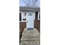 Inviting front entrance with light blue door and welcoming mat at 11 Eastridge Dr, Greenwood, IN 46143