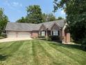 Beautiful brick home with well-maintained lawn and landscaping creating great curb appeal at 11253 Loch Raven Blvd, Fishers, IN 46037