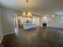Open concept living room with hardwood floors and fireplace at 17389 Dallington St, Westfield, IN 46074
