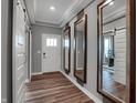 Bright and spacious entryway with wood-look floors and barn doors at 19509 Mcbee Ave, Westfield, IN 46074