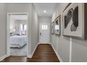 Bright hallway with hardwood floors and access to bedroom at 196 Brunson St, Westfield, IN 46074