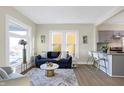Spacious living room with hardwood floors, a comfortable sofa, and natural light at 2215 Brookside Ave, Indianapolis, IN 46218