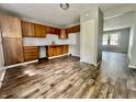 Eat-in kitchen with wood cabinets and tile backsplash at 2533 Aurie Dr, Indianapolis, IN 46219