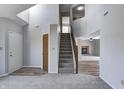 Inviting living room with neutral paint, an open stairway, and a glimpse into the adjacent living spaces at 368 Seabreeze Cir, Avon, IN 46123