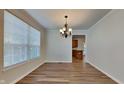 Spacious dining room with hardwood floors and chandelier at 5131 Nicodemus Dr, Plainfield, IN 46168