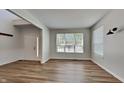 Living room with hardwood floors and large windows at 5131 Nicodemus Dr, Plainfield, IN 46168