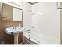 Full bathroom with pedestal sink and shower/tub combo at 6847 W 15Th St, Indianapolis, IN 46214