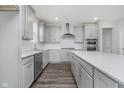 Modern kitchen featuring an island, stainless steel appliances, and sleek light gray cabinetry at 7300 Legends Way, Whitestown, IN 46052