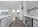 Kitchen boasting white quartz countertops, an island, stainless appliances, and hard surface flooring at 7300 Legends Way, Whitestown, IN 46052