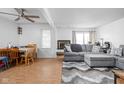 Open living room with gray sectional sofa and dining area at 741 Ironwood Dr, Avon, IN 46123