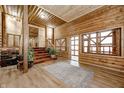 Rustic entryway with wooden staircase and decor at 9600 N 500 E, Pendleton, IN 46064