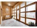 Bright sunroom with wooden walls and many windows at 9600 N 500 E, Pendleton, IN 46064