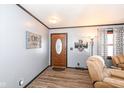 Front entry with wood flooring and neutral decor at 1269 Casco Bay Cir, Cicero, IN 46034
