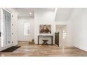 Bright entryway with hardwood floors, console table, and stairs at 1561 N Park Ave, Indianapolis, IN 46202