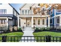 Two-story house with gray siding, front porch, and walkway at 1561 N Park Ave, Indianapolis, IN 46202