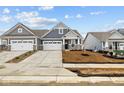Charming two-story home featuring a two-car garage, and a well-manicured lawn, perfect for comfortable living at 16956 Cattle Hollow Ln, Noblesville, IN 46060