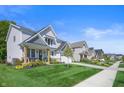 Row of houses showcasing similar architectural style and landscaping at 19950 Chatham Green Dr, Westfield, IN 46074