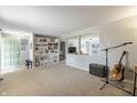 Spacious living room featuring built-in shelving and abundant natural light at 2338 Malibu Ct, Anderson, IN 46012
