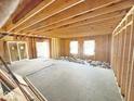 Unfinished basement with exposed framing and poured concrete floor at 2913 Macpherson Ave, Indianapolis, IN 46205
