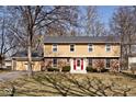 Charming two-story home with brick accents and a well-maintained front yard at 6826 E 65Th St, Indianapolis, IN 46220