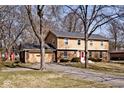 Charming two-story home with brick accents and a well-maintained front yard at 6826 E 65Th St, Indianapolis, IN 46220