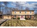 Charming two-story home with brick accents and a well-maintained front yard at 6826 E 65Th St, Indianapolis, IN 46220