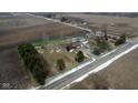 Lovely property featuring a charming home, outbuilding, and large fenced in yard at 7855 E 200 S Rd, Whitestown, IN 46075