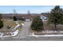 Charming home featuring a well-maintained lawn and a detached outbuilding at 7855 E 200 S Rd, Whitestown, IN 46075