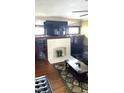 Living room features a fireplace, built-in shelving, and hardwood floors at 917 E 34Th St, Indianapolis, IN 46205