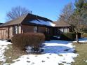 Brick ranch home with snow-covered lawn at 1114 Willow Springs Blvd, Brownsburg, IN 46112