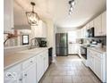 Modern kitchen featuring stainless steel appliances and white cabinetry at 12738 Buff Stone Ct, Fishers, IN 46037