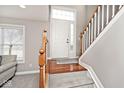 Welcoming entryway featuring hardwood floors, a staircase, and a bright, inviting atmosphere at 335 Autumn Dr, Carmel, IN 46032