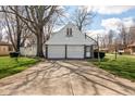 Spacious two-car garage with a traditional design and ample parking space at 3521 Manchester Rd, Anderson, IN 46012
