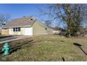 Side view of ranch home showcasing a large backyard at 4102 Barnor Dr, Indianapolis, IN 46226