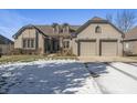 Two-story house with a two-car garage and partial snow cover at 7059 Koldyke Pl, Fishers, IN 46038